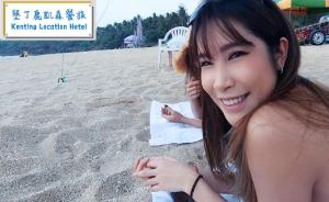 南湾垦丁鹿凯森餐旅-恋恋南湾的坐在海滩上的年轻女人