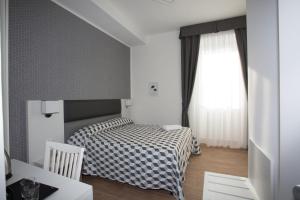 Guesthouse Porto di Roma客房内的一张或多张床位