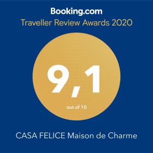 塔兰托CASA FELICE Maison de Charme的黄色圆圈,上面有文字旅行审查奖