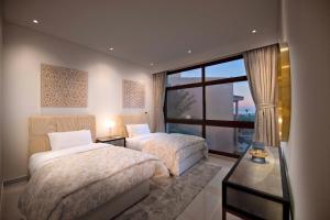 Dibba, Villa 61 - Mina Al Fajer, Dibba Al Fujairah客房内的一张或多张床位