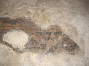 尚勒乌尔法怡乐斯科纳吉精品酒店的洞穴地板上的一幅画