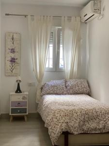 WISH SUITE NIEBLA DE SEVILLA客房内的一张或多张床位