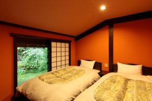 汤本朝哉日式旅馆客房内的一张或多张床位