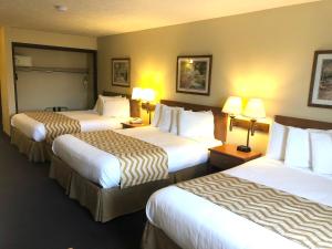 格兰岛温德姆旅程住宿酒店客房内的一张或多张床位