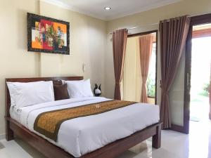 Villa Dira Ubud客房内的一张或多张床位