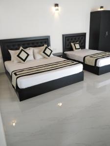 尼甘布3R Resort的两张床位 - 带两张西德西德床