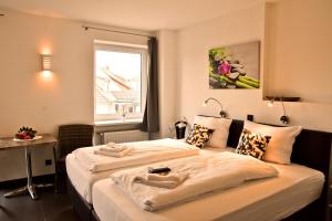 Hotel Walsroder Hof客房内的一张或多张床位