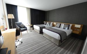 纽卡斯尔皇冠假日酒店 - 史蒂芬森区客房内的一张或多张床位