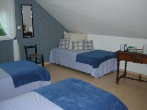 洛萨奥内住宿加早餐旅馆客房内的一张或多张床位