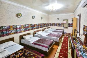 Bukhara Star Guest House客房内的一张或多张床位