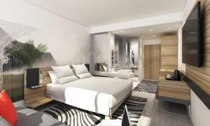 伦敦诺富特伦敦滑铁卢酒店的卧室配有白色的床和电视。
