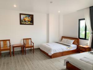 Hotel Thiện Nhiên客房内的一张或多张床位