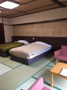 Yunogo Bishunkaku客房内的一张或多张床位