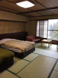 Yunogo Bishunkaku客房内的一张或多张床位