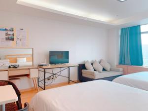 仁川机场勾勾之家客房内的一张或多张床位