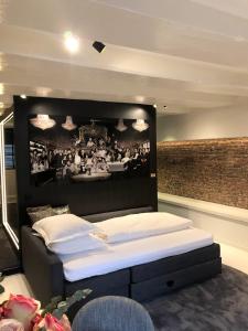 Luxury Canal Suite De Heren客房内的一张或多张床位