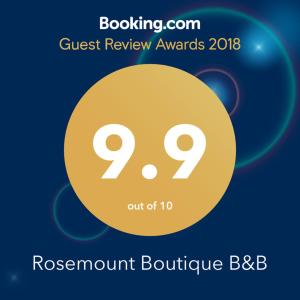 拉纳克Rosemount Boutique B&B的蓝色背景的黄色圆圈,带有单词roxinantoutine bbb