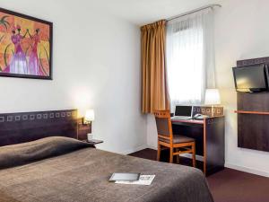 巴黎波特德查荣同爱达格公寓式酒店客房内的一张或多张床位