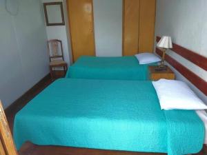 Hostal Lluvia de Oro客房内的一张或多张床位