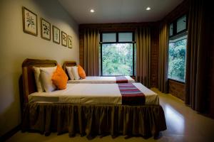 Malagos Garden Resort客房内的一张或多张床位