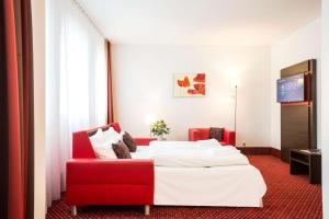 维也纳爱米迪亚贝斯特韦斯特优质酒店客房内的一张或多张床位