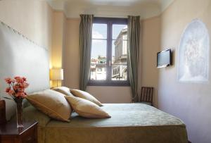 佛罗伦萨景致食宿酒店客房内的一张或多张床位