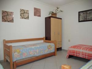 Jóias Preciosas- Kitnet Mobiliado客房内的一张或多张床位