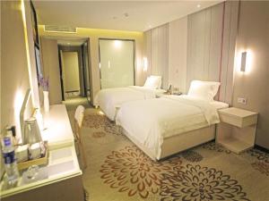 麗枫酒店·贵阳花果园财富广场店客房内的一张或多张床位
