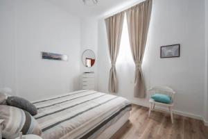 Cosy flat in the heart of Cadiz客房内的一张或多张床位