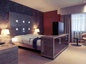 蒂尔堡中心美居酒店客房内的一张或多张床位