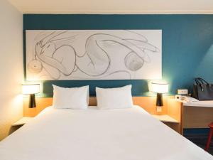 ibis Reims Centre客房内的一张或多张床位