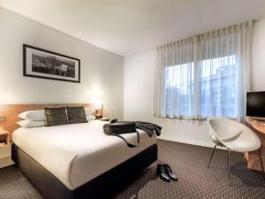 墨尔本宜必思公寓式酒店客房内的一张或多张床位
