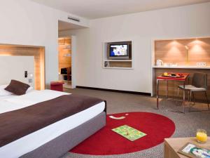 美居斯图加特机场展览会酒店客房内的一张或多张床位