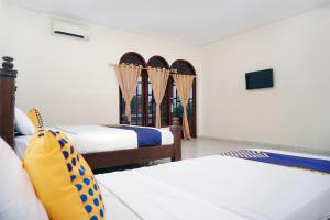 SPOT ON 2629 Duta Karimun客房内的一张或多张床位