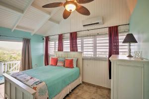 La ValleeSt Croix Home with Caribbean Views - 1 Mi to Beach的一间卧室配有一张床和吊扇