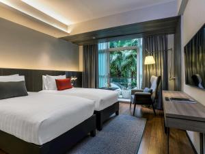曼谷铂尔曼皇权酒店客房内的一张或多张床位