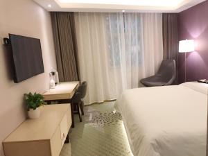 麗枫酒店·吐鲁番大十字店客房内的一张或多张床位