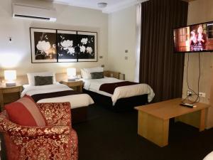 Mariners Court Hotel Sydney客房内的一张或多张床位