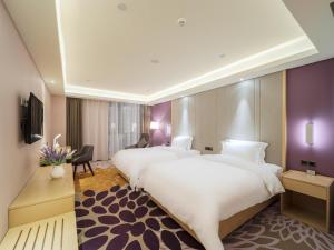 麗枫酒店·清镇职教城时光贵州店客房内的一张或多张床位