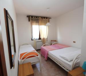 Villa Gloria appartamento E01客房内的一张或多张床位