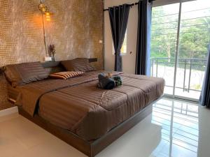 M Hostel And Cafe at Khao Kho客房内的一张或多张床位