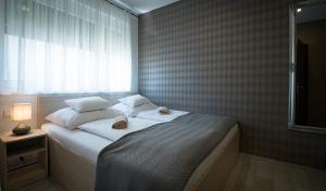 ATANA Luxury Apartments客房内的一张或多张床位