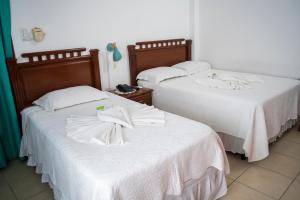 Buen Retiro Apart Hotel客房内的一张或多张床位