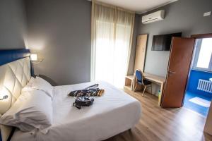 Hotel Gran Sasso & SPA客房内的一张或多张床位