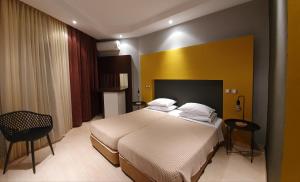 阿普洛提岛公园酒店客房内的一张或多张床位