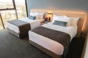 QUARTZ HOTEL & SPA客房内的一张或多张床位