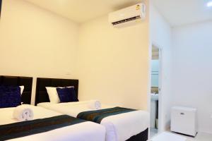Vamin Resort Chiangkhan Loei วามินทร์รีสอร์ท เชียงคาน เลย客房内的一张或多张床位