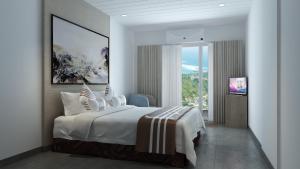 Port ElizabethSpring Hotel Bequia的白色卧室设有一张大床和电视。