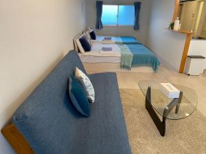 Maison L Motobu客房内的一张或多张床位