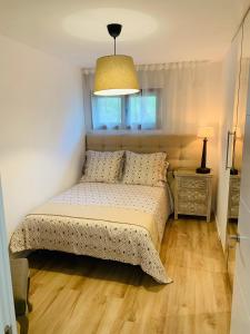 Apartamento con encanto Puerto de Navacerrada客房内的一张或多张床位